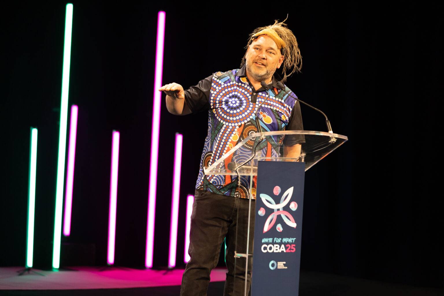 Local elder performs a Welcome to Country ceremony at COBA25 in Brisbane.